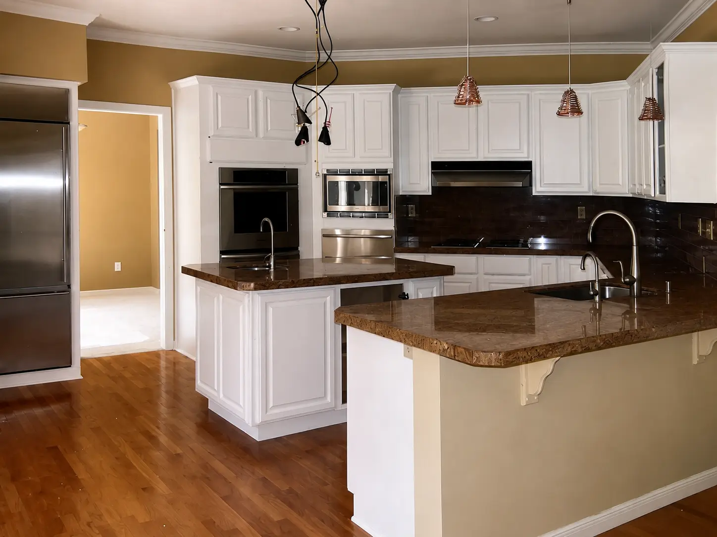 White painted kitchen cabinets with granite counters